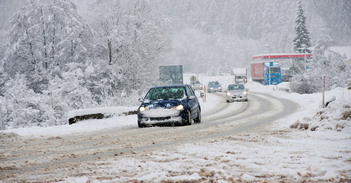 shot of car on snow-covered road